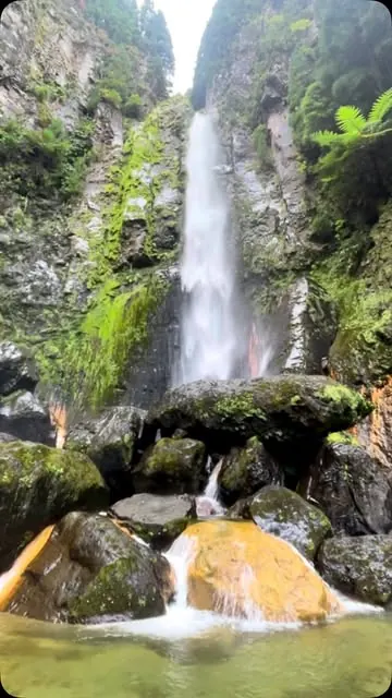The waterfall at Lombadas, São Miguel, falling into a green pool